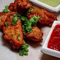 Chicken Wings (4) W/ Fries  · Get a serving of four fresh, crispy, golden brown chicken wings fried then tossed in your ch...