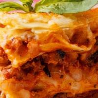 Lasagna · Pasta layered with ricotta, ground beef and parmigiano reggiano, topped with sauce and mozza...