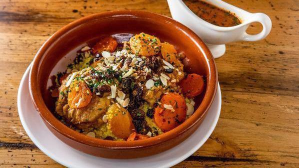 Chicken Tagine · Apricot, raisins, almonds, couscous, and spicy carrots.