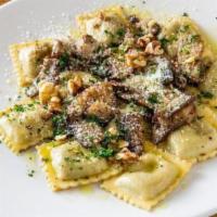 Mushroom Ravioli · Portobello mushroom, walnuts, parmesan, and truffle oil.<br /><br />