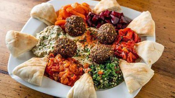 Combination Platter · Babaganoush, hummus, beets, tabouli, falafel, matbucha, carrots, and roast pepper.