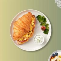 Eggin' For Croissant & Salad · Two cage free scrambled eggs, Swiss cheese, chipotle mayo served in a croissant with a side ...