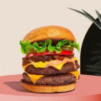 Two Impossible Cheese Burger · Double impossible patty, vegan cheddar cheese, lettuce, tomato, onion, pickles, and stone gr...