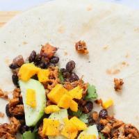 Vegetarian Burrito · White rice or brown rice, corn salsa, mango chutney, mango salsa, tambourine