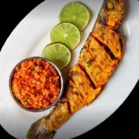 Tandoori Whole Fish (Golden Pompano) · Pomfret fish marinated with hung battered yogurt and Indian spices.