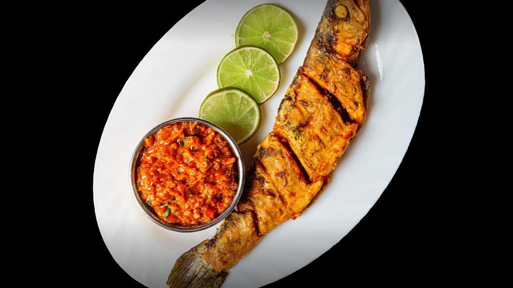 Tandoori Whole Fish (Golden Pompano) · Pomfret fish marinated with hung battered yogurt and Indian spices.