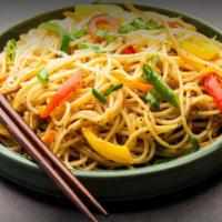 Hakka Noodles · A long grain stir fried rice with a combination of your choice of toppings served in a count...