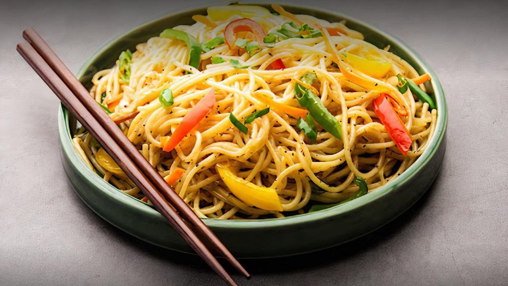 Hakka Noodles · A long grain stir fried rice with a combination of your choice of toppings served in a country culture.