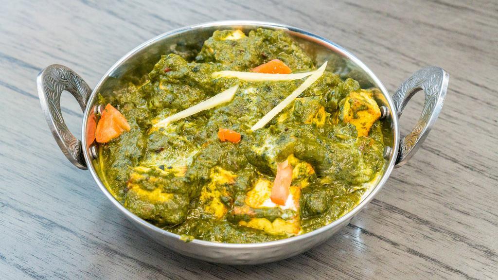 Palak Paneer · Indian cottage cheese (paneer) cooked with fresh spinach and light cream.
