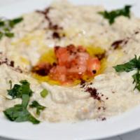 Babaghanoush · Smoked eggplant puree, tahini, garlic spices, and olive oil. Served with Homemade Turkish br...