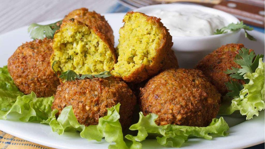 Falafel (5 Pcs) · Chickpeas, celery, parsley, lettuce, cumin, black pepper and salt served with white sauce or tahini sauce.