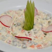 Russian Salad · Mayonnaise with potato, pickles, carrots, and peas. Served with Turkish bread.