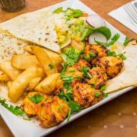 Chicken Shish Kebab · Fire roasted marinated cubes of chicken. Served with potato wedges, salad, white sauce, lava...