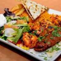 Chicken Shish & Adana Kebab · Fire roasted chicken shish and adana (long kofeth) stick. Served with potato wedges, salad, ...