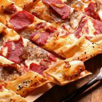 Mixed Pide · Thick dough crust topped w/ diced meat, soujouk, pastrami & melted cheese