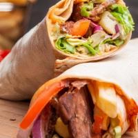 Gyro Doner Wrap · Thinly-sliced ground lamb and beef with lettuce, onions, tomatoes. Served with potato wedges...