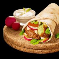 Falafel Wrap · Lettuce, onions, tomatoes, served with potato wedges and white sauce on the side.