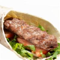 Adana Wrap · Ground lamb and beef meat, tomatoes, lettuce, onions. Served with potato wedges and white sa...