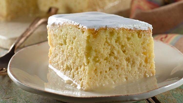 Tres Leches · Sponge cake soaked in three different sweet milks, decorated with a whipped cream topping.