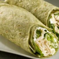 Vegan Chicken Caesar Wrap · Vegan chicken with vegan cheese, lettuce, tomato, and Caesar dressing, served on a spinach w...