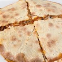 Lahm-Dilla · Double Lahm bi Ajin sandwich with gooey syrian string cheese, tomato jam, and nigella seeds