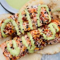 Baked Salmon Skewer Party · Everything seasoning- baked salmon fillet skewers served with a side of pita and cilantro li...