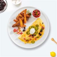 Mexican Omelette · Eggs, onions, tomatoes, jalapenos, and cheese. Served with side of toast and home fries.