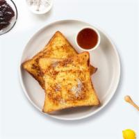 French Toast · Fresh bread battered in egg, milk, and cinnamon cooked until spongy and golden brown. Served...