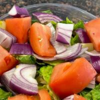 House Salad · Lettuce, tomato, and red onion. Served with creamy italian dressing.