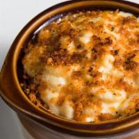 Baked Mac And Cheese Plate · Housemade four cheese sauce with herbed crusted topping.