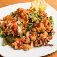 Spicy Calamari Plate · Seasoned calamari with peppers, onions, and cilantro drizzled with sweet chili sauce.