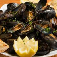 Steamed Mussels Pots · PEI mussels served in your choice of Garlic White Wine Broth or Red Plum tomato Sauce.. Serv...