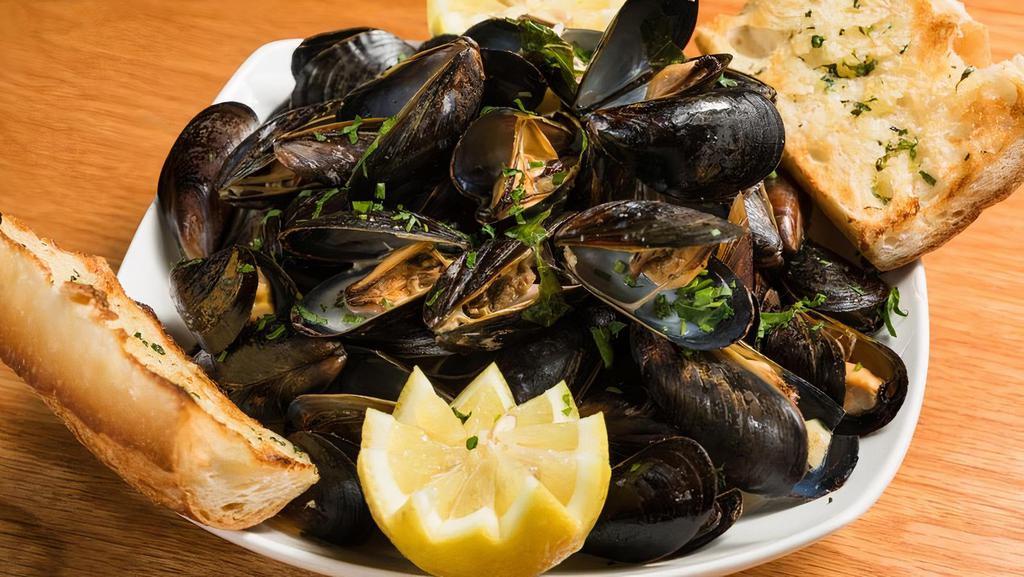 Steamed Mussels Pots · PEI mussels served in your choice of Garlic White Wine Broth or Red Plum tomato Sauce.. Served with Garlic Bread