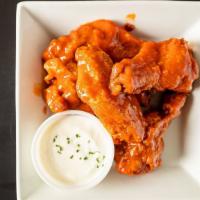 Wings · Popular menu item. Served with a choice of style.