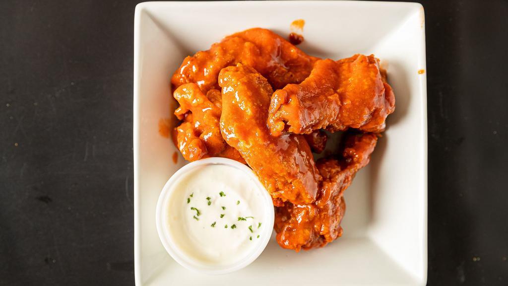Wings · Popular menu item. Served with a choice of style.