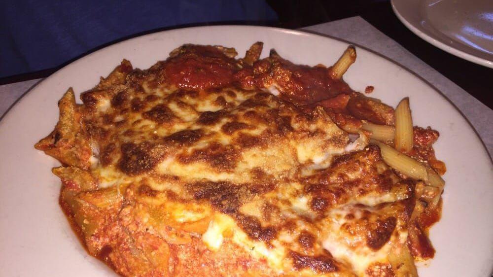 Baked Ziti · Ziti pasta tossed with tomato sauce and ricotta, topped with mozzarella cheese.