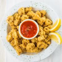 Calamari Fritti · Golden fried calamari served with a side of homemade marinara sauce.