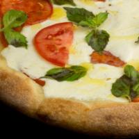 Margherita · Thin crust pizza with fresh plum tomato sauce, fresh mozzarella and basil.