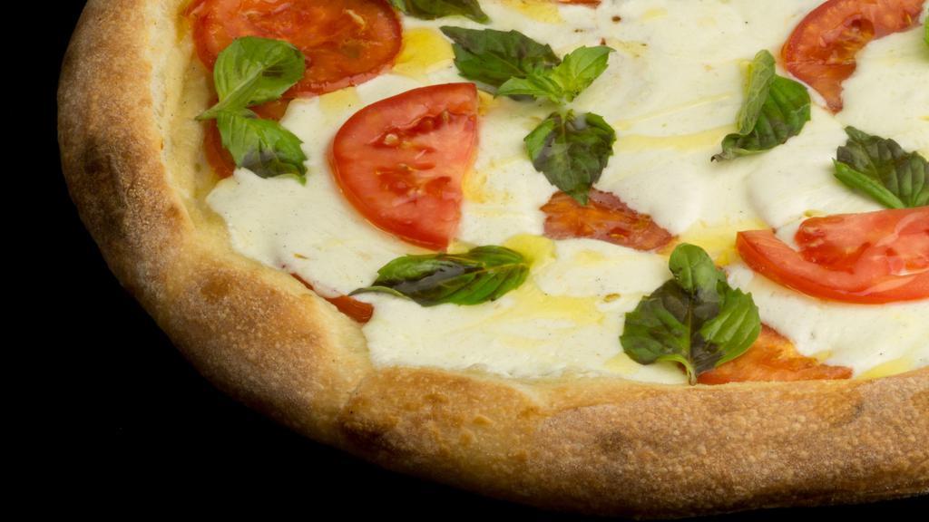 Margherita · Thin crust pizza with fresh plum tomato sauce, fresh mozzarella and basil.