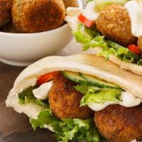 Falafel Sandwich · Comes in pita bread with salad and sauce.