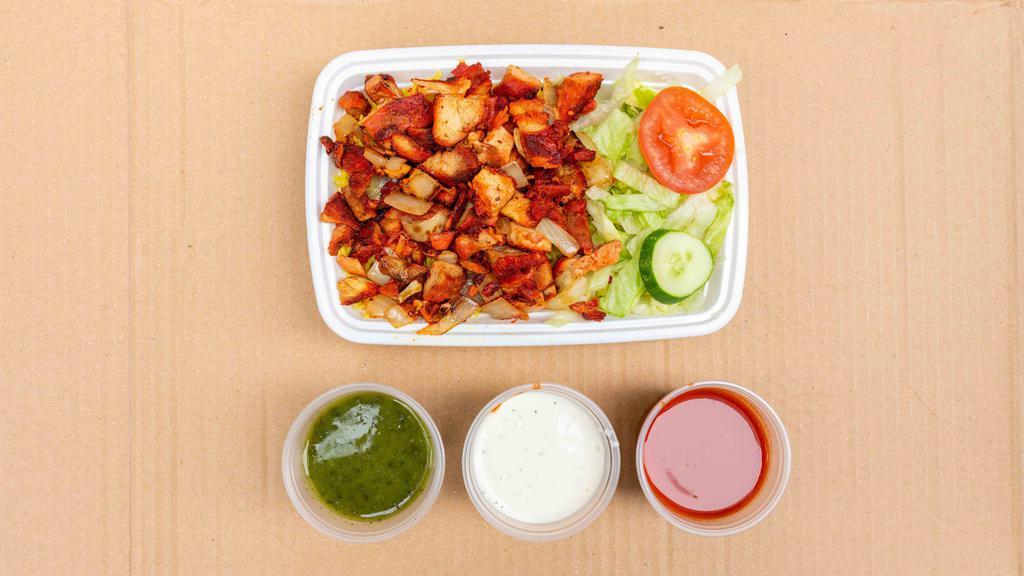 Chicken Over Rice · Comes with salad and sauce.