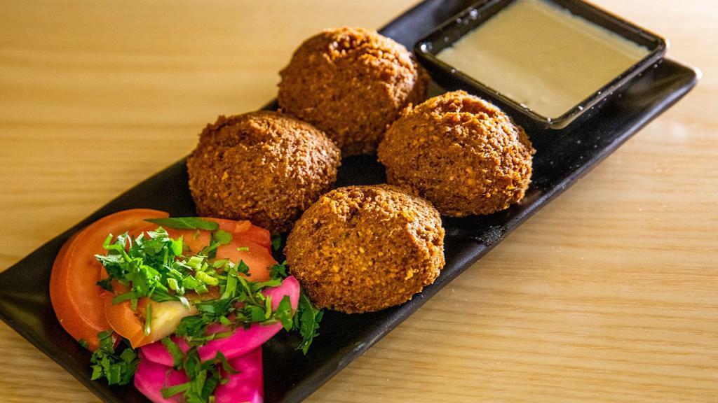 Beef Falafel · Chickpea patties mixed with beets, parsley, onion, garlic and cilantro.