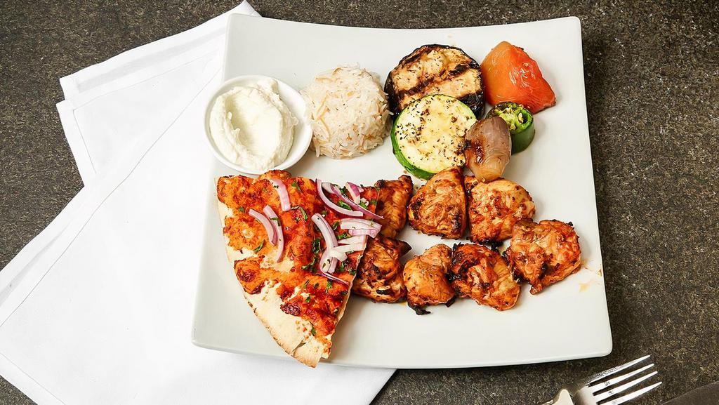 Shish Tawook · Grilled seasoned chicken tender.
Served with grilled vegetables, rice and garlic aioli.