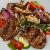 Lamb Chops · Grilled lamb chops.
Served with grilled vegetables and rice.