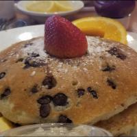 Chocolate Chip Pancakes · Served with maple butter and dusted with powdered sugar.