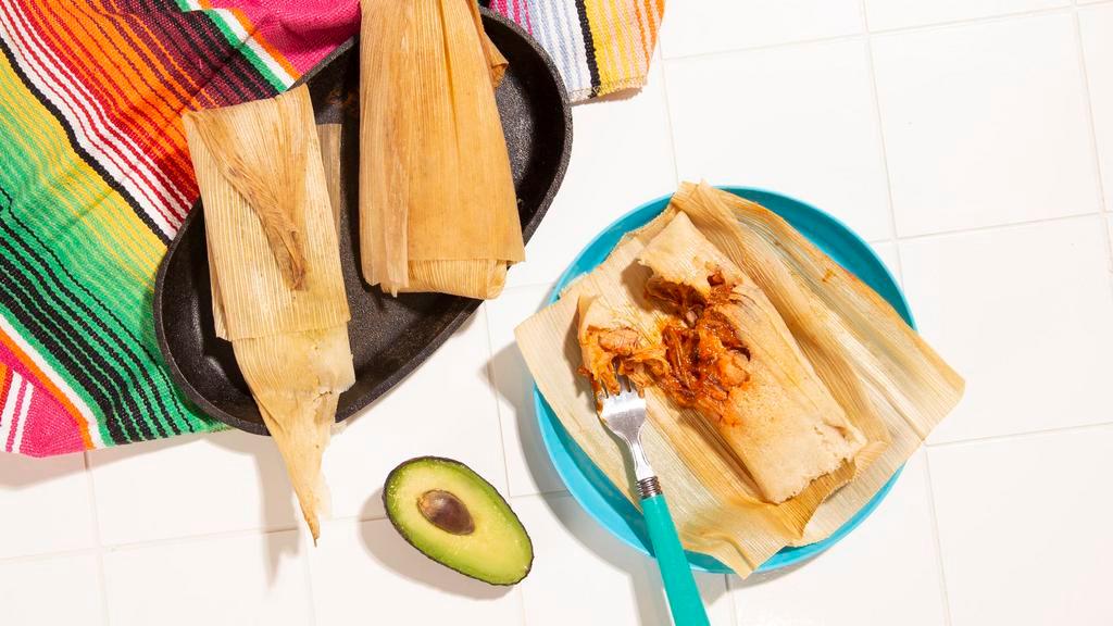 Tamales · Corn dough steamed in a corn husk. Served with salsa.