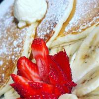 Nanaberry Pancake · Topped with bananas and strawberries.