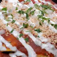 Enchiladas Salsa Roja · 3 Soft Corn Tortillas on a bed of white or brown rice, drowned in Salsa Roja, stuffed with t...