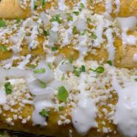 Enchiladas Salsa Verde · 3 Soft Corn Tortillas on a bed of white rice, drowned in Salsa Verde, stuffed with the prote...