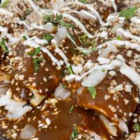 Enchiladas Mole Sauce · 3 Soft Corn Tortillas on a bed of white rice, drowned in Mole Sauce, stuffed with the protei...